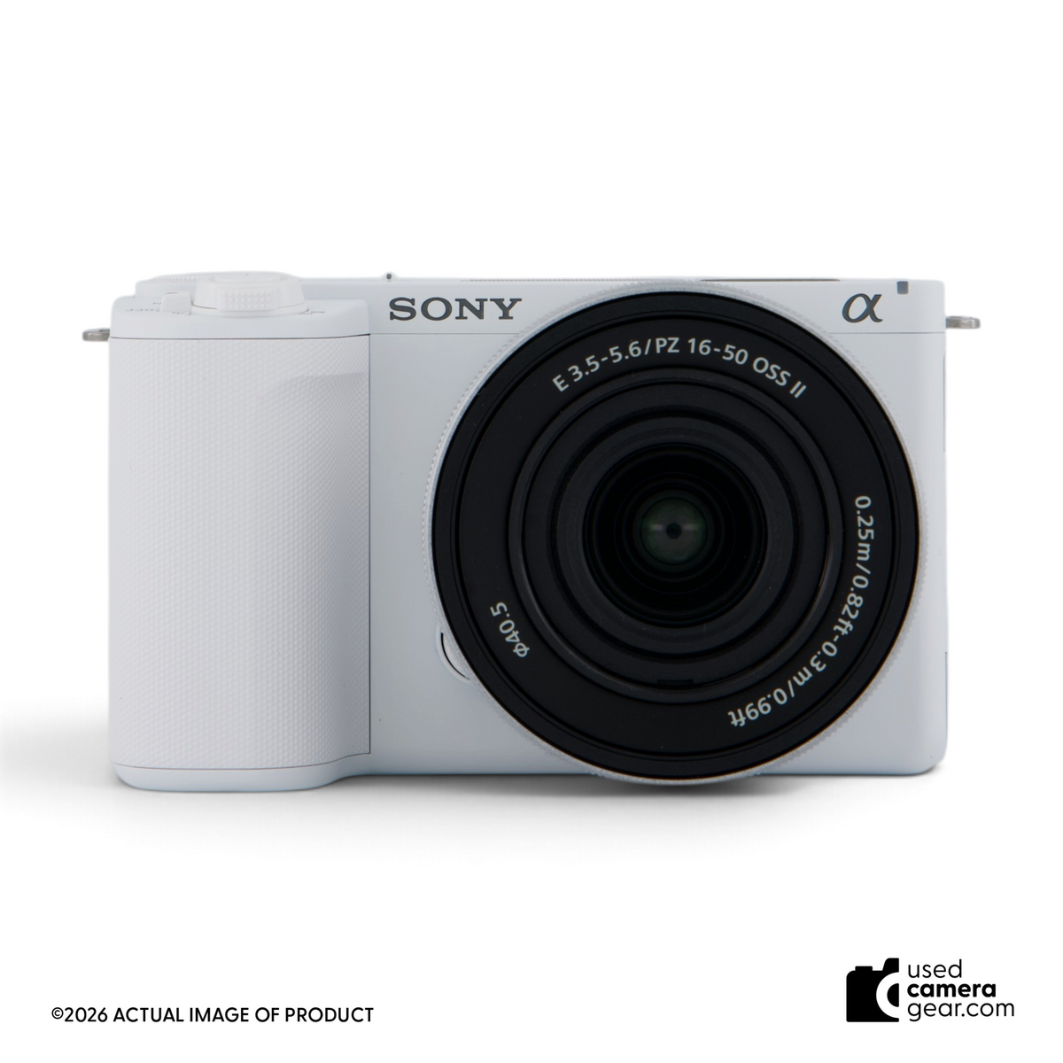 Used Sony ZV-E10 II white mirrorless camera with 16-50mm power zoom lens, front view.