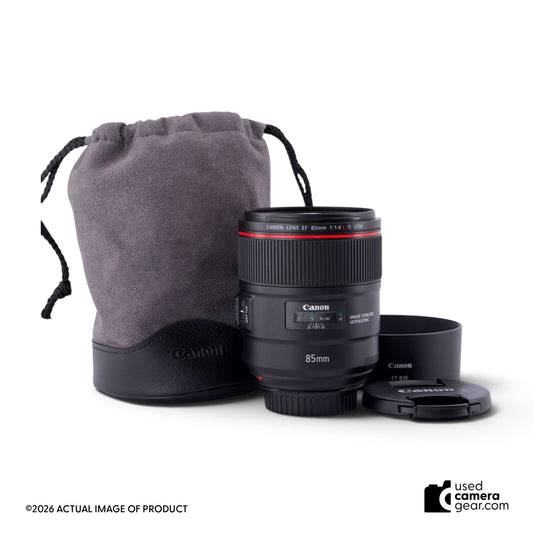 usedcameragear Canon EF 85mm f/1.4L IS USM lens with lens hood, cap, and pouch on a white background