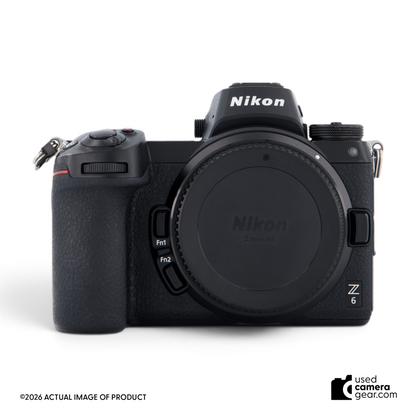 Used Nikon Z6 full-frame mirrorless camera body in black with lens mount cap, front view.