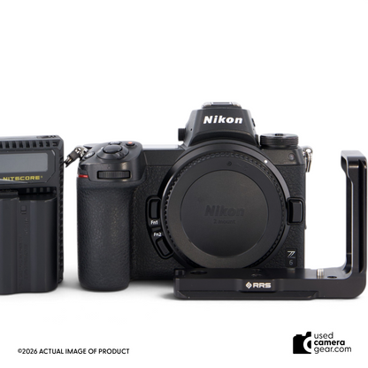 Used Nikon Z6 mirrorless camera body in black with attached RRS L-bracket, front view.